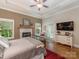Comfortable bedroom with fireplace, dresser, neutral tones, and view of an outdoor patio at 3394 Rainbow Dr, Waxhaw, NC 28173
