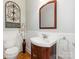 Half bath with decorative wainscoting, modern fixtures, and wood vanity at 3394 Rainbow Dr, Waxhaw, NC 28173