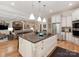 Bright kitchen with a large island, stainless steel appliances, and an open concept to the living room at 3394 Rainbow Dr, Waxhaw, NC 28173