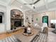 Spacious living room boasts a stone fireplace and decorative coffered ceilings at 3394 Rainbow Dr, Waxhaw, NC 28173