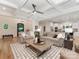 Bright and airy living room open to the kitchen with ample seating and natural light at 3394 Rainbow Dr, Waxhaw, NC 28173