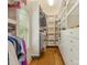 Well-organized walk-in closet with custom shelving and drawers for efficient storage of clothing and accessories at 3394 Rainbow Dr, Waxhaw, NC 28173