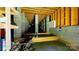Unfinished basement with concrete supports and wooden beams providing ample space for storage and customization at 3633 Longpond Ln, Monroe, NC 28110