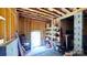 Bright unfinished basement featuring open door, storage, and ample space for customization and storage at 3633 Longpond Ln, Monroe, NC 28110