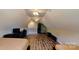 Loft-style bedroom with two beds, ceiling fans, and wood flooring at 3633 Longpond Ln, Monroe, NC 28110