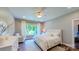 Bright bedroom features natural light, a ceiling fan, and neutral decor at 3633 Longpond Ln, Monroe, NC 28110