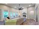 Comfortable living room with large windows, fireplace, and modern decor at 3633 Longpond Ln, Monroe, NC 28110
