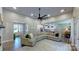 Spacious living room featuring hardwood floors, modern lighting, and comfortable seating at 3633 Longpond Ln, Monroe, NC 28110