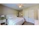 Comfortable main bedroom has wood floors, a ceiling fan, and a double-door closet at 3633 Longpond Ln, Monroe, NC 28110