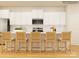 Modern kitchen featuring white cabinets, stainless steel appliances, and bar seating at 3829 Horsham St, Indian Land, SC 29707