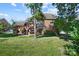 Lovely backyard featuring a brick home, nice lawn, a deck and a charming pergola at 4009 Oxford Mill Rd, Waxhaw, NC 28173