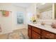 Well-lit bathroom with a large window and a classic vanity at 4009 Oxford Mill Rd, Waxhaw, NC 28173