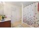 Functional bathroom with a butterfly shower curtain and a tiled floor at 4009 Oxford Mill Rd, Waxhaw, NC 28173