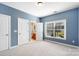 Comfortable bedroom with ensuite bathroom and a view of the outdoors at 4009 Oxford Mill Rd, Waxhaw, NC 28173