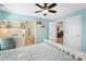 Comfortable bedroom featuring built-in shelving and a neutral color palette at 4009 Oxford Mill Rd, Waxhaw, NC 28173