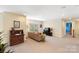 Large bonus room provides lots of natural light, sitting area, and decor for multiple uses at 4009 Oxford Mill Rd, Waxhaw, NC 28173