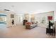Spacious bonus room offers neutral decor with large window and comfortable sitting area at 4009 Oxford Mill Rd, Waxhaw, NC 28173