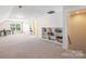 Spacious bonus room with ample natural light and built-in bookshelves at 4009 Oxford Mill Rd, Waxhaw, NC 28173
