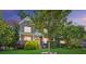 Beautiful two story home boasting stone and brick exterior, front porch, and manicured landscaping at 4009 Oxford Mill Rd, Waxhaw, NC 28173