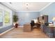 Bright home office with wood floors, a large window, and built-in storage at 4009 Oxford Mill Rd, Waxhaw, NC 28173