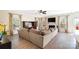 Spacious living room with fireplace, large sofa, and lots of natural light at 4009 Oxford Mill Rd, Waxhaw, NC 28173