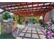 Inviting outdoor patio with a pergola, fireplace, and built-in grill at 4009 Oxford Mill Rd, Waxhaw, NC 28173