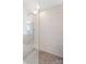Modern shower with decorative tiles, gray hexagon tile floor, and glass door at 4009 Oxford Mill Rd, Waxhaw, NC 28173