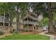 Charming multi-story condo with a brick facade, covered patios, landscaped yard, and a walkway at 433-68 W 8Th St, Charlotte, NC 28202