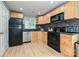 Charming kitchen with stainless steel appliances, wooden cabinets, and stylish backsplash at 433-68 W 8Th St, Charlotte, NC 28202