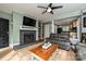 Comfortable living room boasts a fireplace and a view into the open-concept kitchen at 433-68 W 8Th St, Charlotte, NC 28202