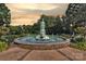Scenic view of a park fountain surrounded by trees and lush greenery at 433-68 W 8Th St, Charlotte, NC 28202