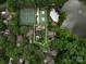 Aerial view of home in a wooded neighborhood with nearby lake and amenities at 5104 Top Seed Ct, Charlotte, NC 28226