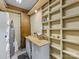 Unfinished basement with storage cabinets, shelves, work bench, and water heater at 5104 Top Seed Ct, Charlotte, NC 28226