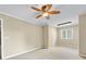 Spacious bedroom with ceiling fan, neutral carpet, and plenty of natural light at 5104 Top Seed Ct, Charlotte, NC 28226