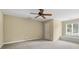 Spacious bedroom with carpet floors, neutral paint, a ceiling fan, and a window seat at 5104 Top Seed Ct, Charlotte, NC 28226