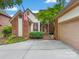 Charming brick home with an American flag, manicured bushes, and attached garage at 5104 Top Seed Ct, Charlotte, NC 28226
