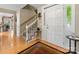 Inviting foyer with hardwood floors, a staircase, and a traditional front door at 5104 Top Seed Ct, Charlotte, NC 28226