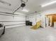 Spacious two car garage with epoxy floors, high ceilings, and garage door openers at 5104 Top Seed Ct, Charlotte, NC 28226