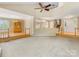 Open living area with beautiful hardwood and carpet floors, seamlessly connecting to dining and entry spaces at 5104 Top Seed Ct, Charlotte, NC 28226