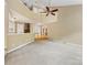 Open-concept living area with a staircase, seamlessly connected to the dining room and entry, bright and airy at 5104 Top Seed Ct, Charlotte, NC 28226