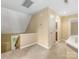 Cozy loft space featuring neutral carpeting and a window with natural light at 5104 Top Seed Ct, Charlotte, NC 28226