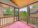 Screened-in porch featuring a wood frame, pink carpet, and views of the backyard at 5104 Top Seed Ct, Charlotte, NC 28226