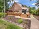 Beautiful brick house with an expansive deck and manicured landscaping, providing an inviting outdoor space at 5104 Top Seed Ct, Charlotte, NC 28226