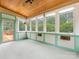 Bright sunroom with large windows and a charming ceiling fan, perfect for enjoying natural light at 5104 Top Seed Ct, Charlotte, NC 28226