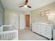 This Bedroom features neutral decor, a crib, changing table, and airplane artwork on the walls at 5334 Orchid Bloom Dr, Fort Mill, SC 29707