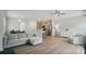 Spacious living room featuring hardwood floors, a modern sofa, and open-concept design at 5334 Orchid Bloom Dr, Fort Mill, SC 29707