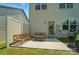 Back patio with a grill and outdoor furniture; access to the house via glass door at 5334 Orchid Bloom Dr, Fort Mill, SC 29707