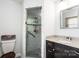 Bathroom featuring a granite sink, shower with glass doors and stone flooring at 5516 Northwood Dr, Hickory, NC 28601