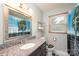 Bathroom with a unique shower curtain, granite sink, and a window with blinds at 5516 Northwood Dr, Hickory, NC 28601