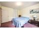 Bedroom with a blue bedspread, closet, and a lamp on the nightstand at 5516 Northwood Dr, Hickory, NC 28601